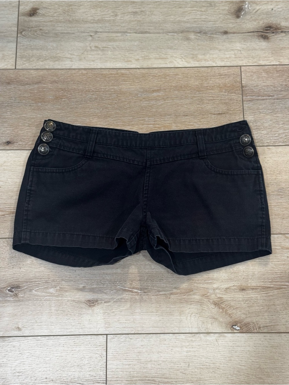 Lost black denim shorts, silver button closures on side, front/back pockets, 7.